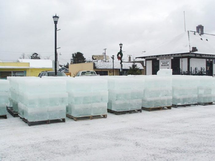 Ice blocks are stacked in front of a building.