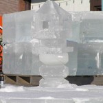 An ice sculpture in front of a building.