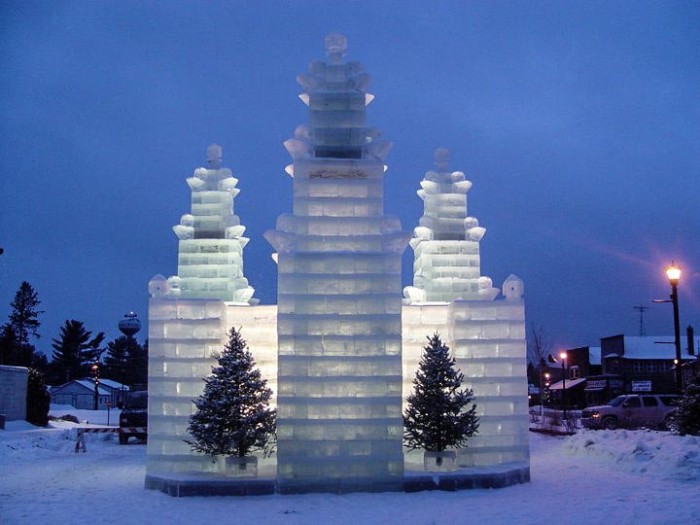 A large ice sculpture in front of a church.