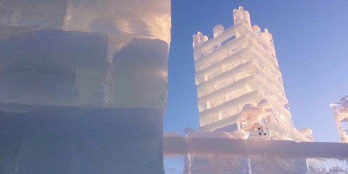 An ice tower with a blue sky in the background.