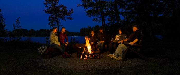 A group of people around a fire.