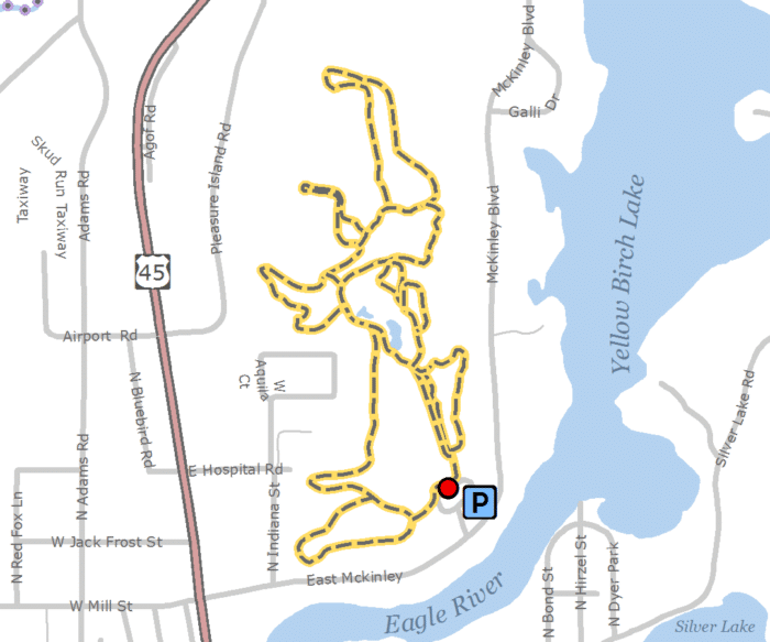 A map showing the location of a lake and a trail.