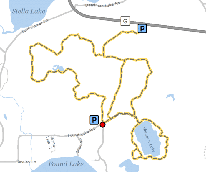 A map showing the location of a trail and a lake.