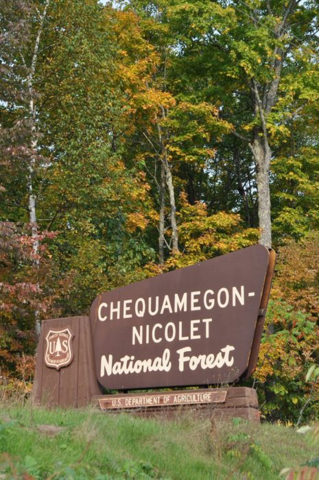 A sign for chequamegon nicolet national forest.