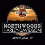 Northwoods Harley-Davidson logo with a sunset and forest silhouette background, located in Arbor Vitae, Wisconsin.