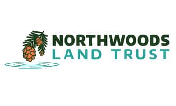 Logo for Northwoods Land Trust, featuring pine cones hanging from branches above wavy water lines, with the text "Northwoods Land Trust" in bold green and blue font.