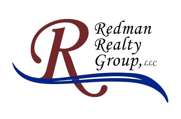 Logo of redman realty group, llc, featuring a stylized red letter 'r' with a blue wave underneath, and the company name in blue and brown text.
