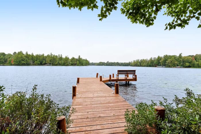A wooden dock leading to a lake.