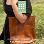 A person wearing a black top holds a brown leather tote bag. Text reads "Verified Fair Trade Federation" and "Welcome newly FTF verified member A Beautiful Calling.