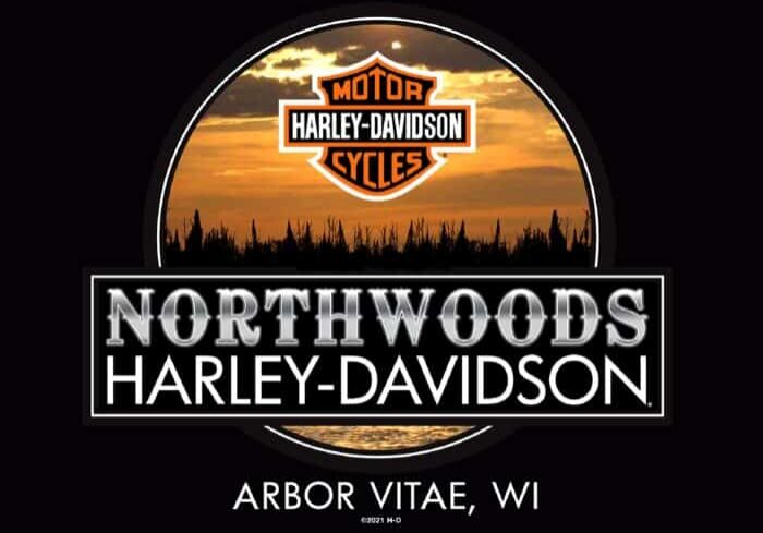 Northwoods Harley-Davidson logo with a sunset and forest silhouette background, located in Arbor Vitae, Wisconsin.