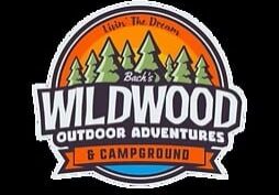 Logo for "Back's Wildwood Outdoor Adventures & Campground" featuring pine trees, a sun, and the slogan "Livin' The Dream" in an orange and green color scheme.
