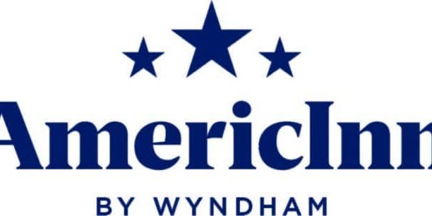 Logo of the AmericInn Motel by Wyndham, featuring the brand name in blue with three stars above the lettering.