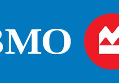 BMO logo featuring white "BMO" text next to a red circle with a stylized white mountain inside, on a blue background.