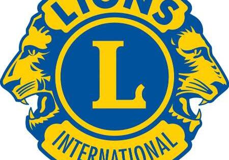 The Lions Club International logo showcases a prominent "L," flanked by lion heads looking in opposite directions, all set against a striking blue and yellow backdrop.
