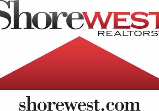 The Shorewest Realtors logo showcases the company name in black and red text above a striking red triangle, with their website shorewest.com elegantly displayed underneath.