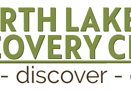 North Lakeland Discovery Center logo with a leaf inside a magnifying glass icon. Text below reads: "inspire - discover - connect.