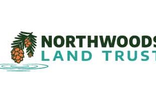 Logo for Northwoods Land Trust, featuring pine cones hanging from branches above wavy water lines, with the text "Northwoods Land Trust" in bold green and blue font.