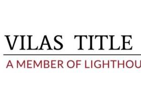 Logo of Vilas Title Service with "VTS" in large red letters and "A Member of Lighthouse Title Group" below in smaller font.