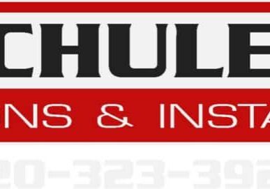 Logo for Schuler Signs & Install, featuring bold black and white text on a red background, with a faint phone number visible at the bottom: 920-323-3924.