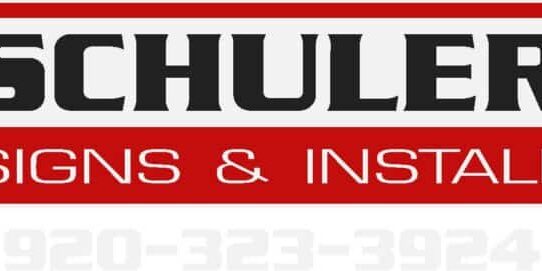 Logo for Schuler Signs & Install, featuring bold black and white text on a red background, with a faint phone number visible at the bottom: 920-323-3924.